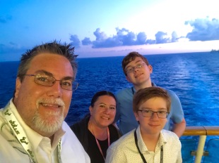 a photo of David Brodosi and family on a boat